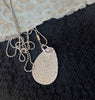 Textured silver pendant necklace